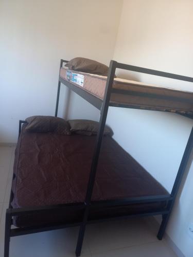 a bunk bed in a room with a bunk bed on it at Teixeira in Olímpia