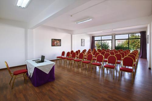 a room with a bunch of chairs and a table at Anezi Tower Hotel in Agadir