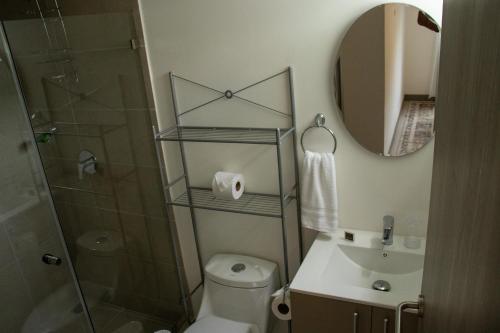 a bathroom with a shower and a toilet and a sink at Punta Esmeralda by Punta Leona in Jacó