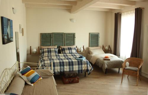 Cama o camas de una habitación en Poesie di Viaggio
