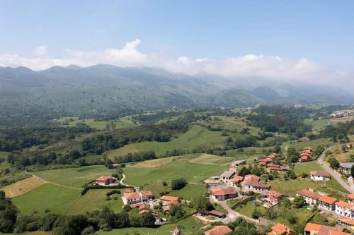 an aerial view of a village in the hills at La Casona de Obdulia II in Tresgrandas