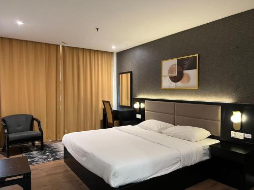Postel nebo postele na pokoji v ubytování Remington Hotel