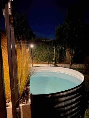 a swimming pool in a yard at night at Refugio Natural, tu lugar en las sierras in Sierra de los Padres