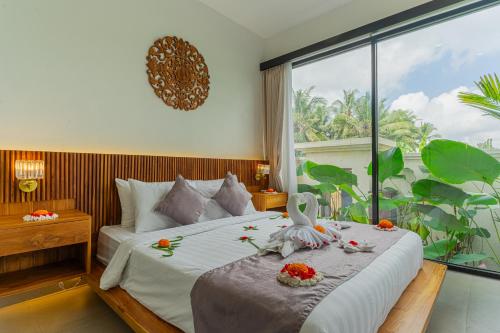 Postel nebo postele na pokoji v ubytování Abian Ubud View
