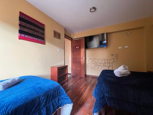 TV a/nebo společenská místnost v ubytování El Parche Rutero Hostel