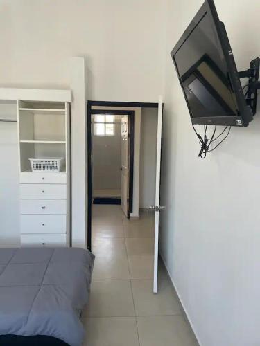 Ένα ή περισσότερα κρεβάτια σε δωμάτιο στο Habitaciones en Casa Casiopea