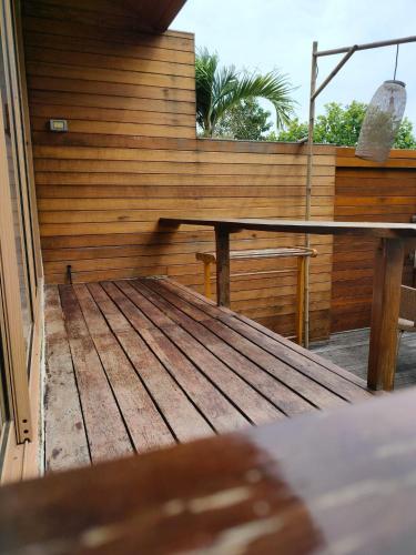 a wooden deck with a bench on top of it at Vimarn Samed Resort in Ko Samed