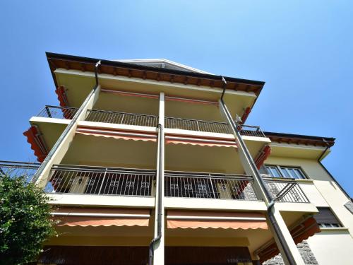 a tall building with a ladder on it at Apartment in a prime location on Lake Maggiore in Verbania