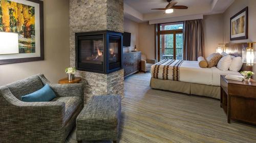 a hotel room with a bed and a fireplace at Hyatt Vacation Club at Northstar Lodge in Truckee