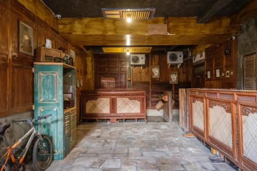 a room with a bed and a bike in it at TwoSpaces Living at Bunga Desa, Jimbaran in Jimbaran