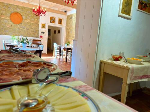 a room with a table with food on it at Nonna Nara Bed & Breakfast in Grosseto