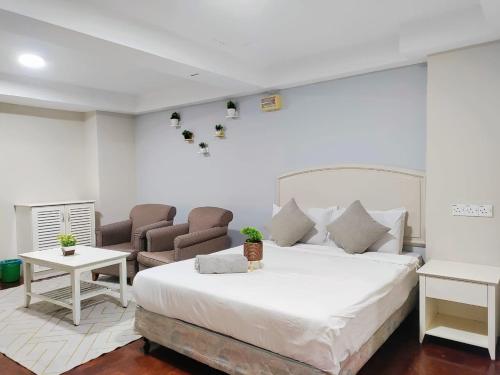 Postel nebo postele na pokoji v ubytování The Little Star Studio Hotel- Star Regency