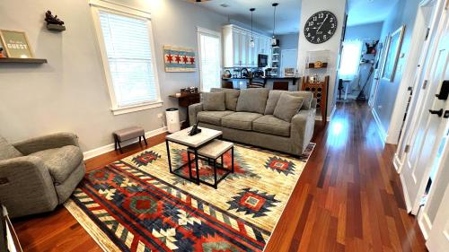a living room with a couch and a table on a rug at Cozy Chicago Apartment next to the River in Chicago