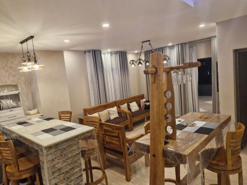 a kitchen and dining room with a table and chairs at Villa for rent in Albion
