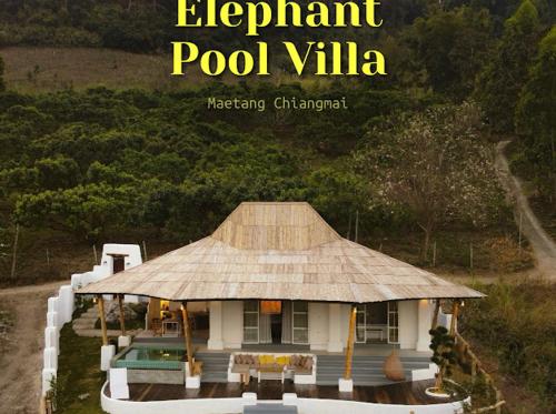 a magazine cover of a house with a roof at Elephantpoolvilla maetang Chiangmai in Ban Muang Kut
