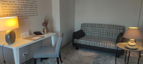 a room with a desk and a chair and a table and a desk at Hotel Via Regia - VIAs-Hotels in Görlitz