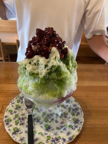 a dessert on a plate on a table at Shioya Hostel in Akune
