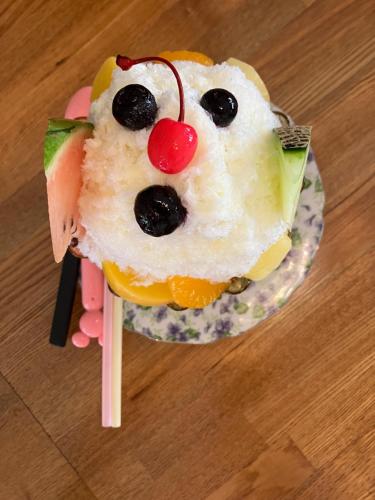 a cake in the shape of a bear on a plate at Shioya Hostel in Akune