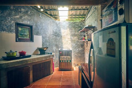 a kitchen with a sink and a counter in a room at Sa Moc - La Maison House & Bungalow in Sa Pa