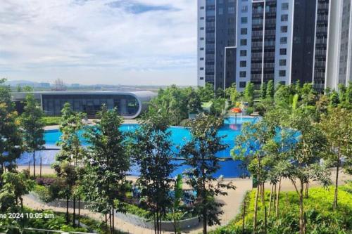 a view of a pool with trees and buildings at D'Splash Homestay SplashMania in Banting