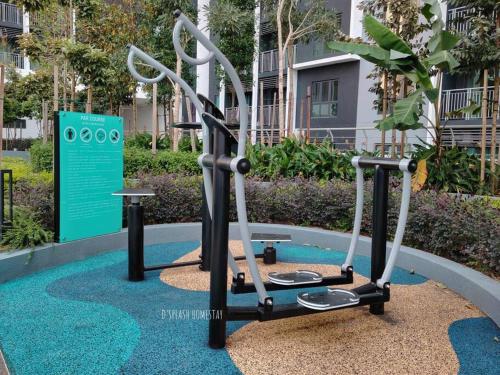 a gym with two exercise bikes in a park at D'Splash Homestay SplashMania in Banting