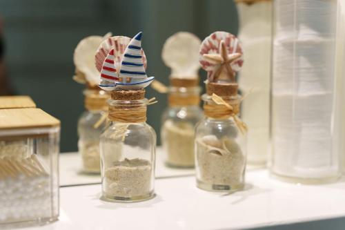 a group of glass bottles with sand in them at Lara free parking Skadarlija in Belgrade