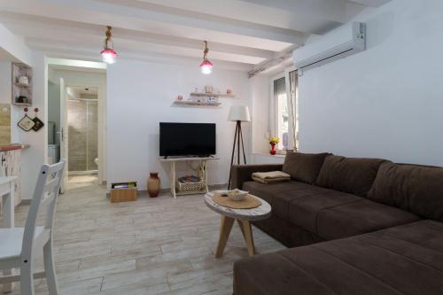 a living room with a couch and a table at Lara free parking Skadarlija in Belgrade