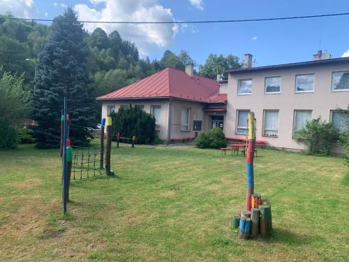 a group of baseball equipment in the yard of a house at Family Paradise Huslenky in Huslenky