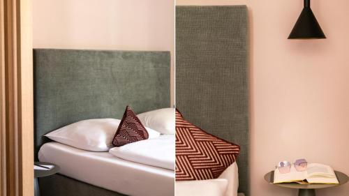 a bedroom with a bed and a mirror at Flora Hotel & Suites in Merano