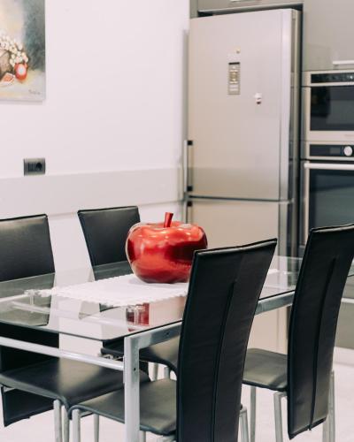 a glass table with an apple sitting on top of it at Epirus Hotel in Sarandë
