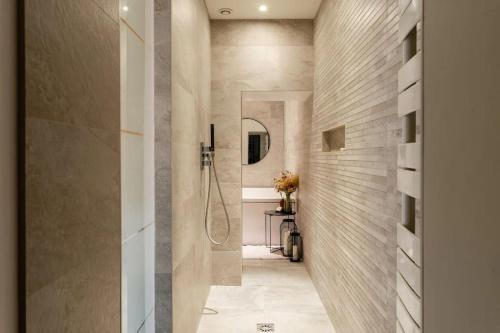 a bathroom with a walk in shower and a walk in shower at Suite Les Nébuleuses, Terreaux Capucins in Lyon
