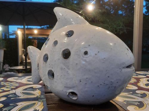 a white vase sitting on top of a table at Hebe Home Riccione in Misano Adriatico