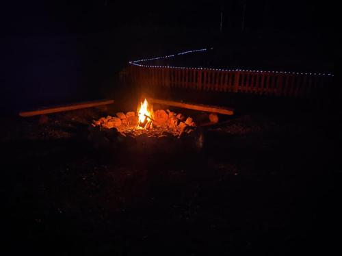 a fire pit in the dark at night at Eglīši in Kalnamuiža