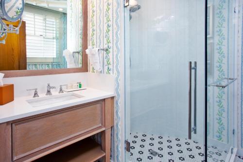 a bathroom with a sink and a shower at The Inn at Stonecliffe in Mackinac Island