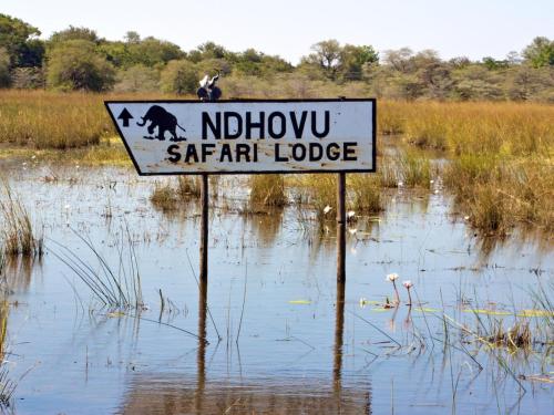 a sign in the middle of a flooded field at Ndhovu Safari Lodge in Mahango