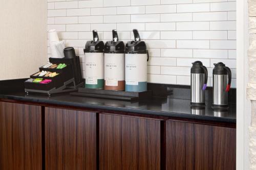 a counter with a bunch of bottles on it at Fairfield Inn Fort Leonard Wood St. Robert in Saint Robert