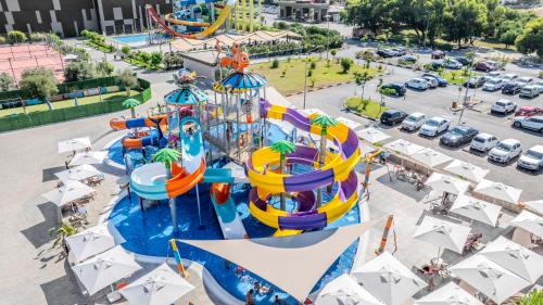 an aerial view of a water park with a roller coaster at The Arkin Iskele in Iskele