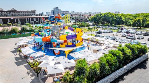 an amusement park with a water slide in a parking lot at The Arkin Iskele in Iskele