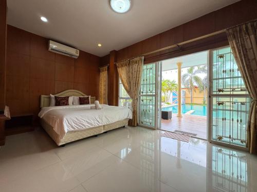 Ένα ή περισσότερα κρεβάτια σε δωμάτιο στο Neolin Asia Pool Villa