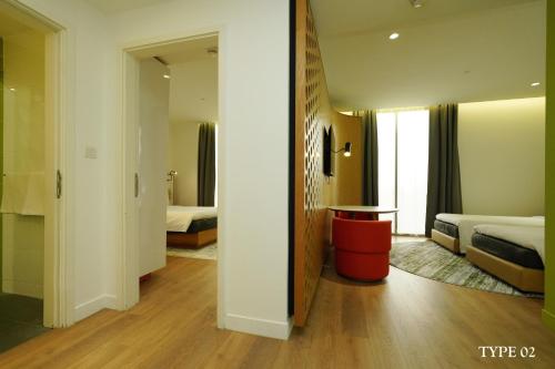 a hotel room with two beds and a table at MU Hotel in Ipoh