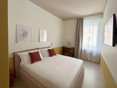 Cama o camas de una habitación en Astom Suites