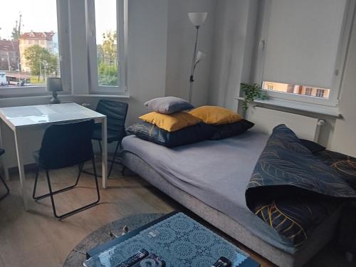 Postel nebo postele na pokoji v ubytování Noclegi KAWALERKA Superior Gdańsk centrum blisko pkp