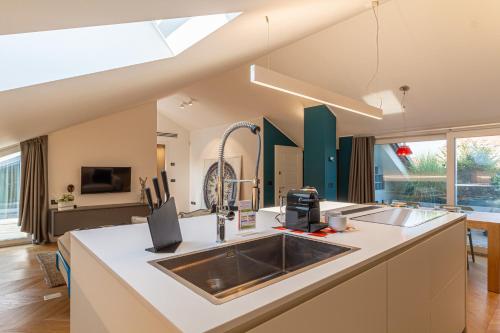 a kitchen with a sink and a counter top at My cup of tea in Seregno