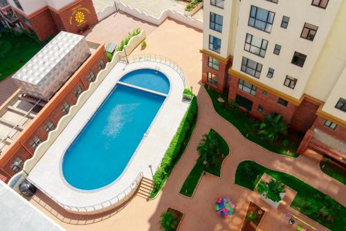 an overhead view of a swimming pool in a building at Greyscape Apple Tree Apartment in Nairobi