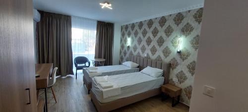Postel nebo postele na pokoji v ubytování ZORA Apartments