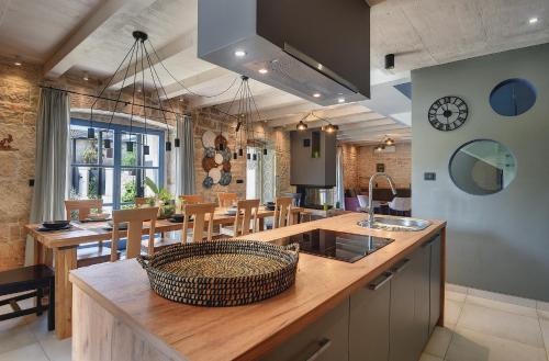 a kitchen and dining room with a basket on a counter at Villa PI for 8 people in Central Istria with heated pool & large garden in Tinjan