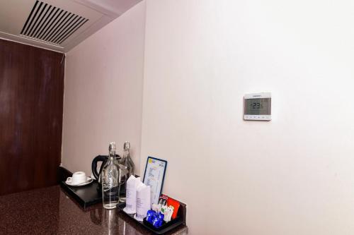 a room with a counter with a clock on the wall at Tsokar Retreat in Leh