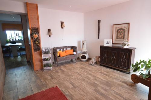 a living room with a couch and a dog in it at Casa 33 in Lagos