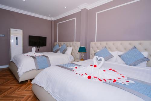 Ένα ή περισσότερα κρεβάτια σε δωμάτιο στο Hotel Apartment Royal Galaxy