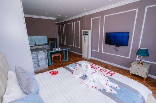 Ένα ή περισσότερα κρεβάτια σε δωμάτιο στο Hotel Apartment Royal Galaxy